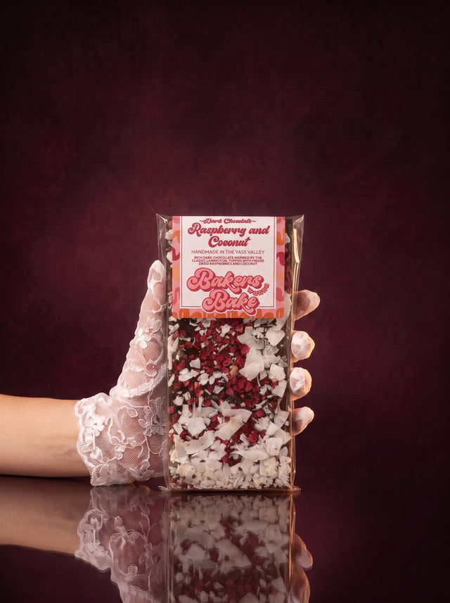 Bakers Wanna Bake dark chocolate bar in Raspberry and Coconut, topped with freeze-dried raspberry and coconut