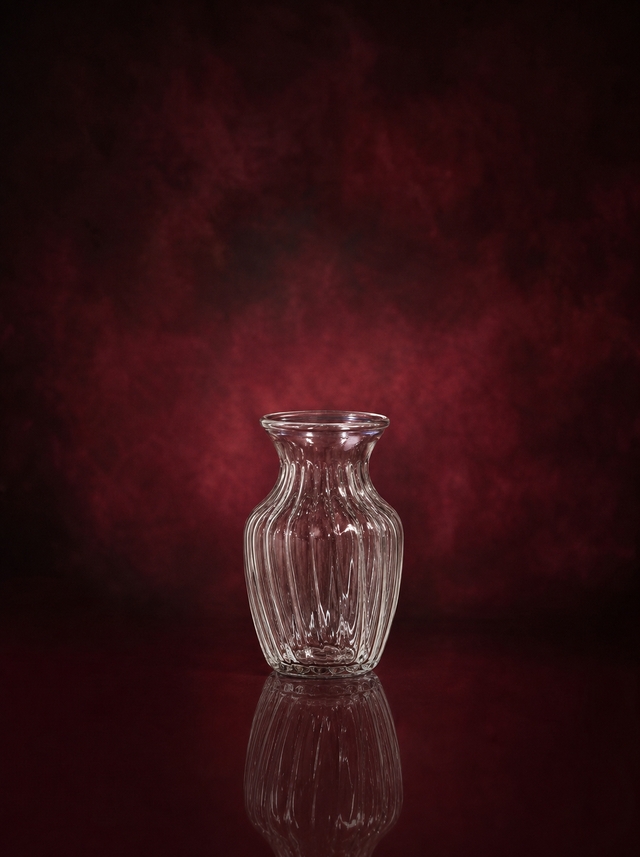 The keepsake vase, a small fluted clear glass vase