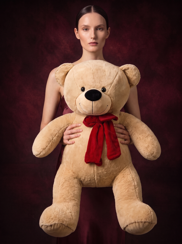 A woman holding the 80cm Grand Bear, showing its size against an adult